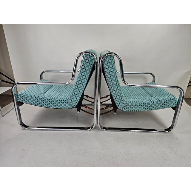 A beautiful set of armchairs with organic chrome shapes and completely reupholstered in a timeless fabric. Fitted with new...