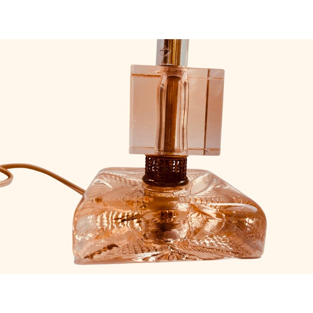 Beautiful apricot glass table lamp from the 1950s. Stunning brass details throughout with the original pleated lamp shade.