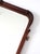 An antique Art Nouveau wall mirror distinguished by its elegantly shaped wood frame and beveled glass. Sculptural curves...