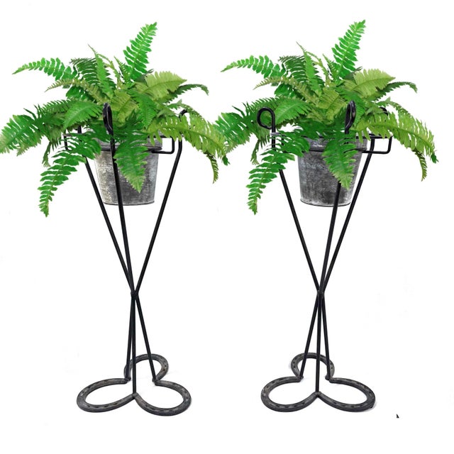 Beyond charming pair of western inspired 1950's plant stands. Each features a base constructed of three "lucky"...