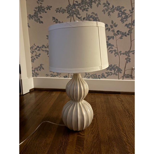 Delphine Lamp features a modern style fluted gourd cast composite base. The natural concrete finish gives a masculine...