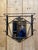 Wrought iron coat rack dating from the early 20th century It has a hat shelf, 4 coat hooks, and an original beveled mirror...