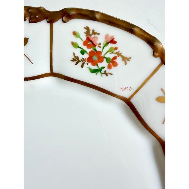 This exquisite French porcelain plate offers an exceptional piece of early 20th-century ceramic artistry. Dated to 1909,...
