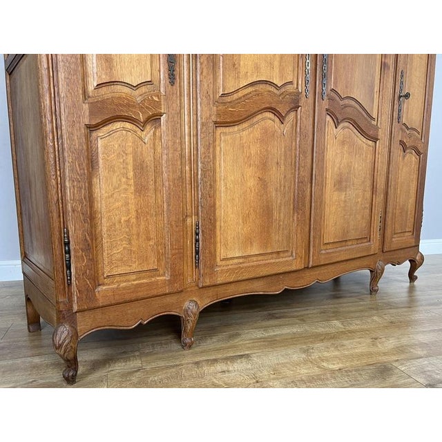 Vintage Louis XVI French Four Door Oak Carved Armoire For Sale - Image 9 of 12