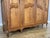 Vintage Louis XVI French Four Door Oak Carved Armoire For Sale - Image 9 of 12