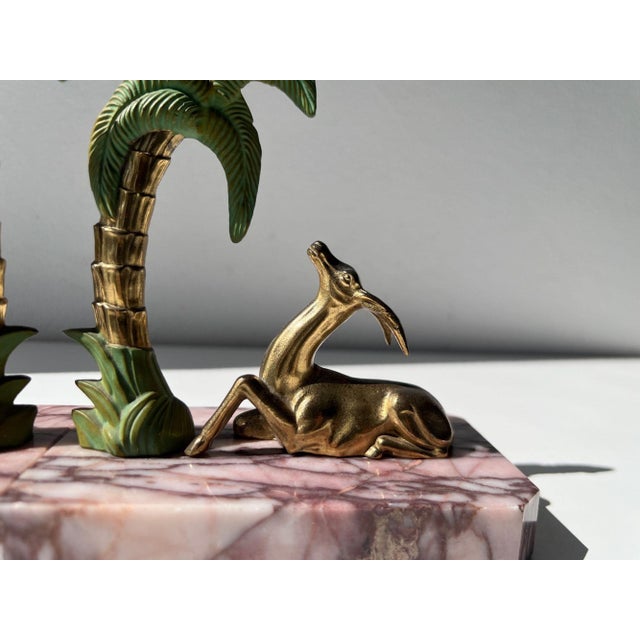 Hollywood Regency / Palm Beach style. Evoking the glamour of French Art Deco, this figural pair of weighty bookends...