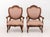 Pair of Louis XVI Style Walnut Fauteuils, each with fruit and vine crest, pink upholstered seat and oval back upon four...