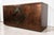 An exceptional 1970s sideboard entirely clad in metal with a coppery bronze patina, boasting deep and subtly nuanced...