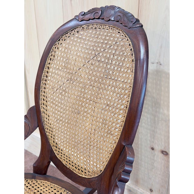 Vintage Victorian Mahogany Cane Back Rocking Chair With Carved Crest For Sale - Image 4 of 7