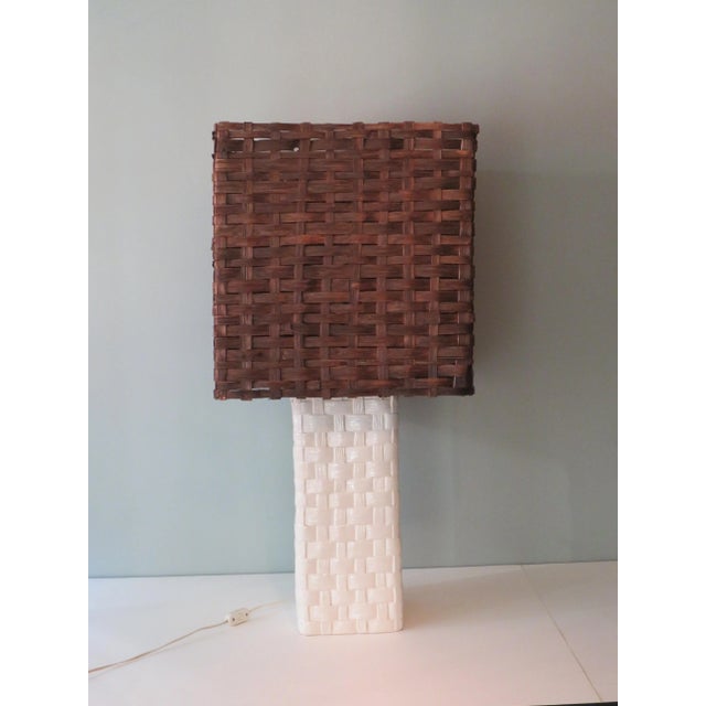 Large ceramic table or floor lamp with ceramic base and square woven wooden shade. The lamp has 1 light point E 27...