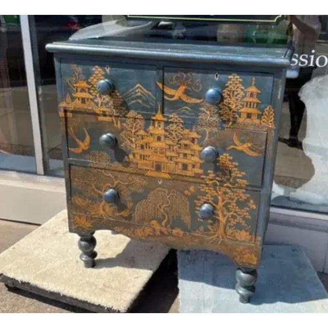 A late 19th Century Pine Chest from England that has recently been painted with a lovely Chinoiserie design on a dark blue...