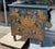 A late 19th Century Pine Chest from England that has recently been painted with a lovely Chinoiserie design on a dark blue...