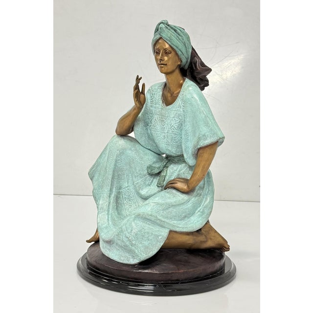 A captivating vintage bronze sculpture by acclaimed Mexican artist Victor Gutierrez, titled "Mujer Sentada" (Seated...