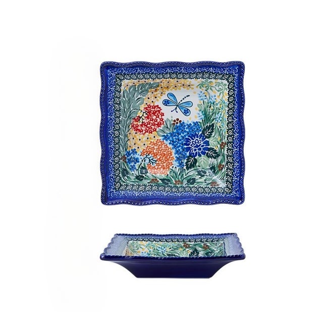 This square plate is a piece of traditional Polish pottery, featuring hand-painted vibrant floral (red, orange, blue...