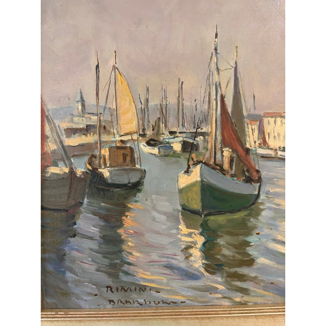 A beautifully atmospheric vintage French oil painting capturing a quiet harbor scene, likely inspired by the southern...