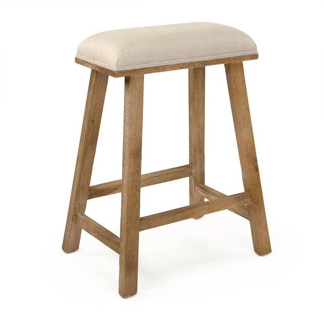 The Jocelyn Counter Stool from Zentique is a casual, farmhouse-inspired backless stool with a padded natural linen seat...