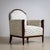 A pair of elegant Art Deco armchairs, likely from France, dating to around 1920. The rounded backrests and straight,...