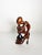 Striking French wooden sculpture dating from the 1970s, depicting a stylized crouching female figure holding a dark...