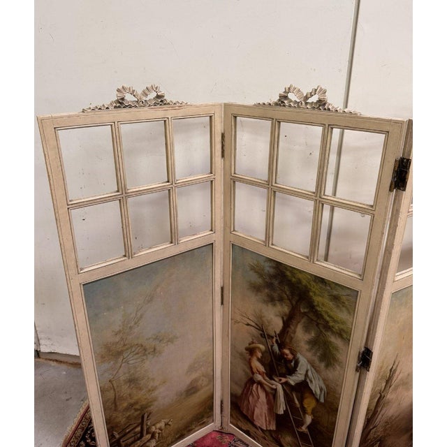 Three-panel Louis XVI style screen with Romantic and landscape decoration Openwork upper section topped with ribboned...