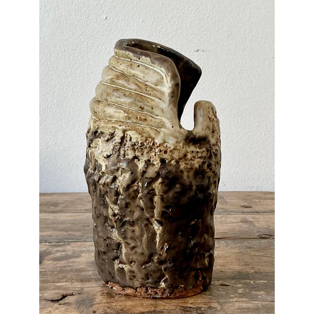 This remarkable studio pottery vase is a masterclass in Brutalist texture and organic form, epitomizing the raw,...