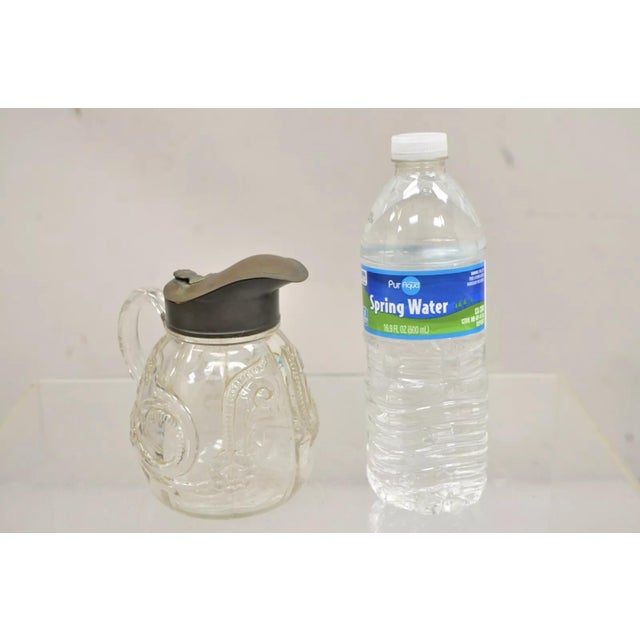 Antique American Art Nouveau Decorated Leaded Glass Creamer Syrup Pitcher. Circa Late 19th Century. Measurements: 5.5" H x...