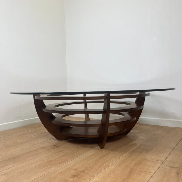 Sculptural coffee table with concentric rings, glass and wood, circa 1985 Important round coffee table, 110 cm in...