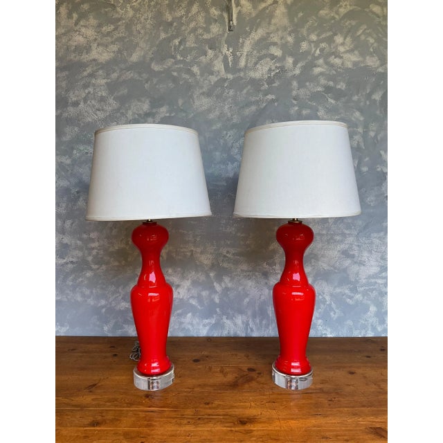 Striking pair of Italian Murano glass table lamps from the 1960s, featuring elegant pawn-form bodies in a vibrant...