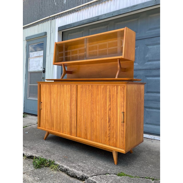 Mid-Century Modern Two-Piece Atomic Style Hutch and Tambour Sideboard by Baumritter. It's the tambour and the unique...