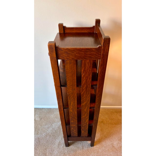 An exceptional, authentic early 20th-century Mission Oak multi-tier magazine stand or bookrack produced by the Stickley...