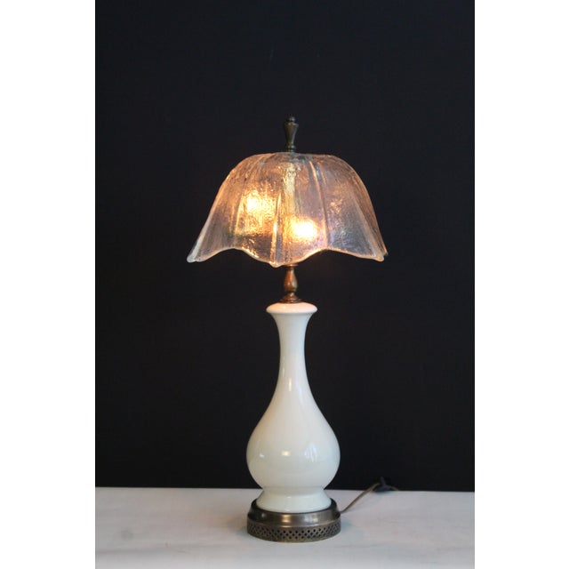Unusual Eastlake influence. Graceful and flowing lines. The body consists Wedgwood style and bronze finish base. Shade is...