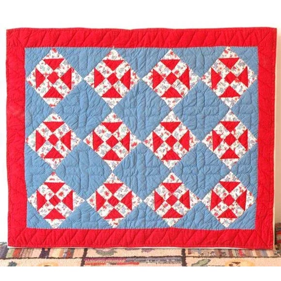1930s red, white and blue doll quilt in mint condition and wonderful geometries placed on a stretcher frame. The quilt is...