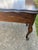 French Style Window Bench with Cabriole Queen Anne Legs . I believe the wood to be a Dark Stained Oak.