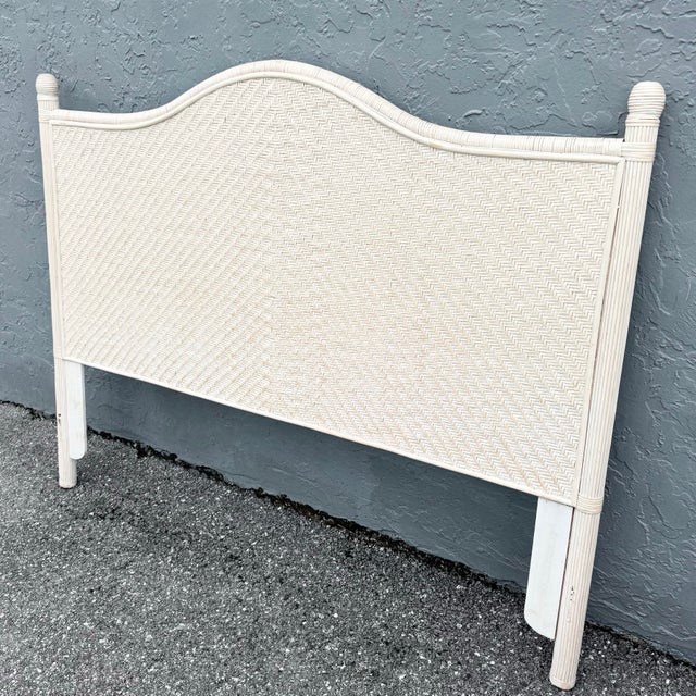 A charming vintage boho chic wicker headboard designed for a queen size bed, featuring a gracefully arched silhouette and...