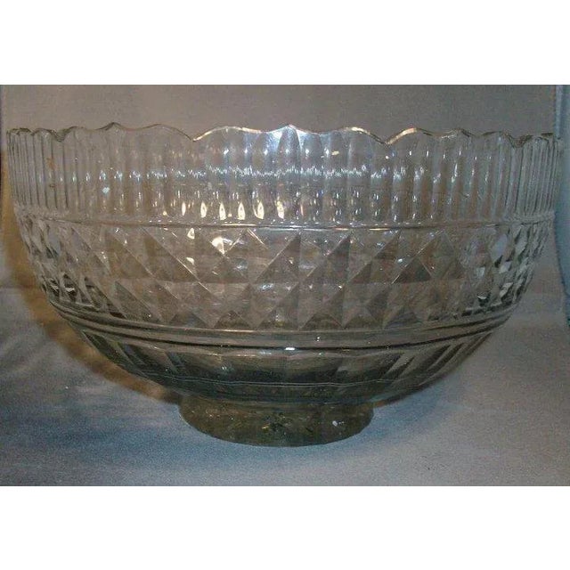 A fine and early cut Anglo Irish lead crystal punch bowl. Thick foot with starburst cut into the bottom. Thumb cut facets...