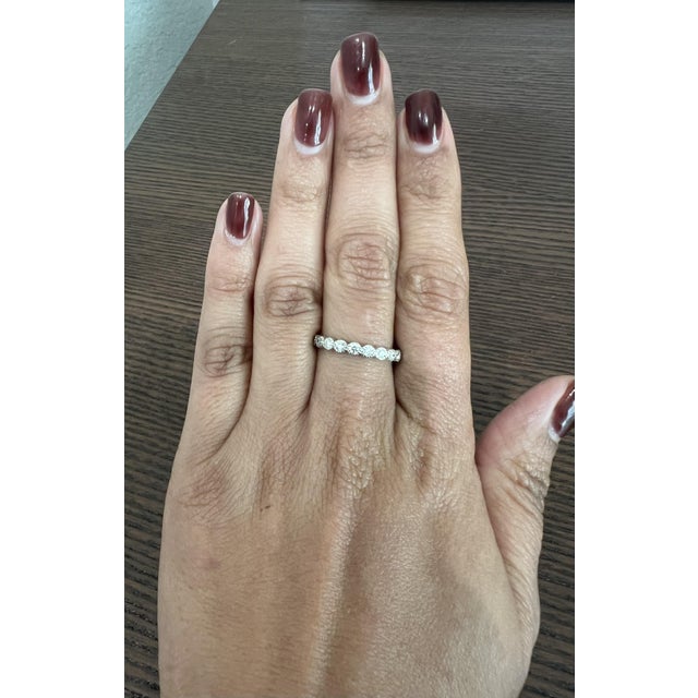 This band has Natural Round Cut Diamonds that weigh 0.44 carats and has a clarity and color of VS-H. The band is...