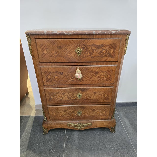 Magnificent Louis XV style chiffonier, made in precious wood marquetry with superb floral inlays. The top is in veined...