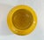 A distinguished Chinese porcelain bowl distinguished by its warm amber glaze and delicate lotus petal motif. The piece...