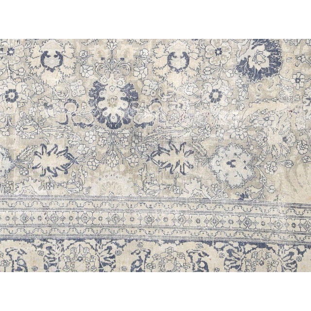 1940s Persian Tabriz Rug. Hand woven in the Tabriz region of Northern Iran. Distressed and refinished in the U.S. The...