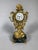 Louis XV style Chinese clock, early 19th century Depicts a Chinese man seated cross-legged supporting a rocaille structure...