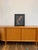 An elegant vintage framed reproduction of Earl Moran's celebrated pin-up illustration "A Modern Eve," capturing the...