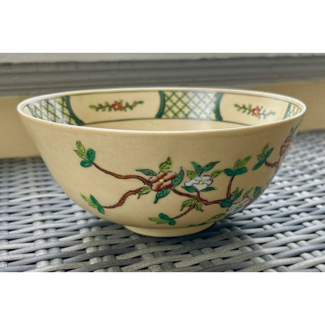 Apple blossom design on an antique white background. Very pretty color combination. The interior part of the bowl near the...