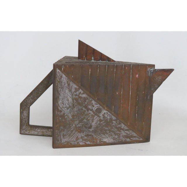 This gorgeous Geometric Kettle / Tea Pot is made out of metal. It has a beautifully unique triangular/prism shape with...
