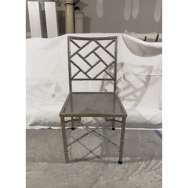 Set of 4 Chippendale style chairs in a brushed silver metal finish. Perfect for game chairs or dining chairs. There are...
