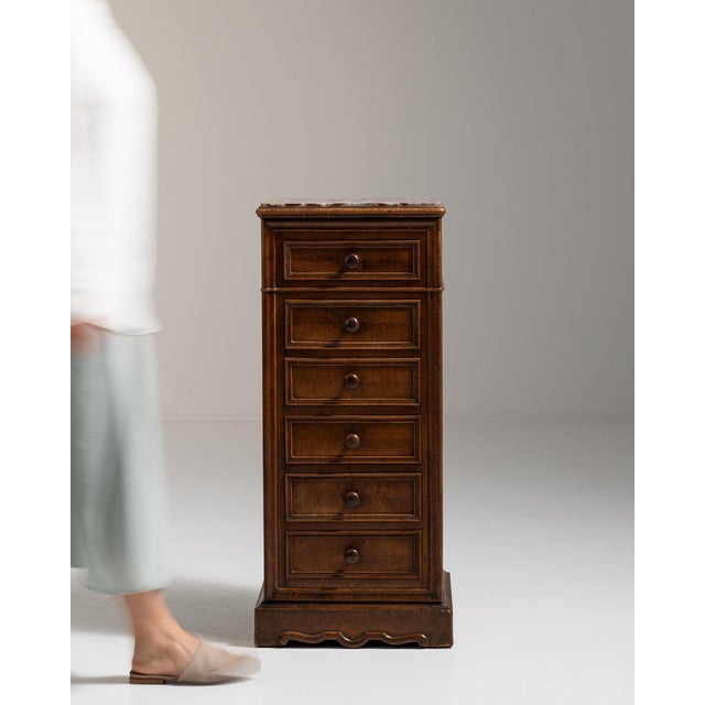 Narrow walnut semainier in Rich Walnut Brown. Finished in rich walnut brown, this narrow walnut semainier is distinguished...