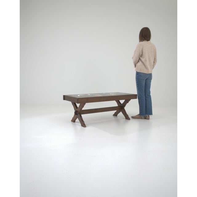 Presenting a striking blend of rustic charm and artisanal flair, this 20th Century French Wooden Coffee Table with Ceramic...