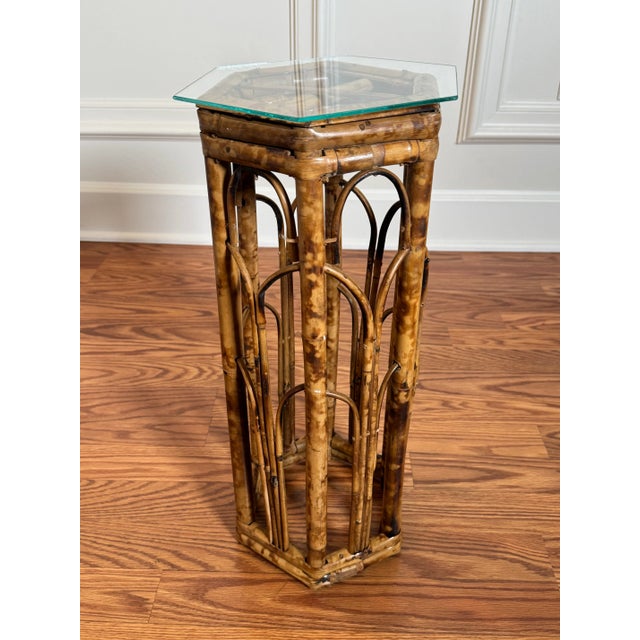 This tortoise shell burnt bamboo drink accent table is a versatile piece, not only in style, but purpose. A beautiful...
