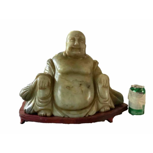This extraordinary antique Chinese sculpture features a massive, one-piece carving of the Happy Buddha (Budai), revered as...