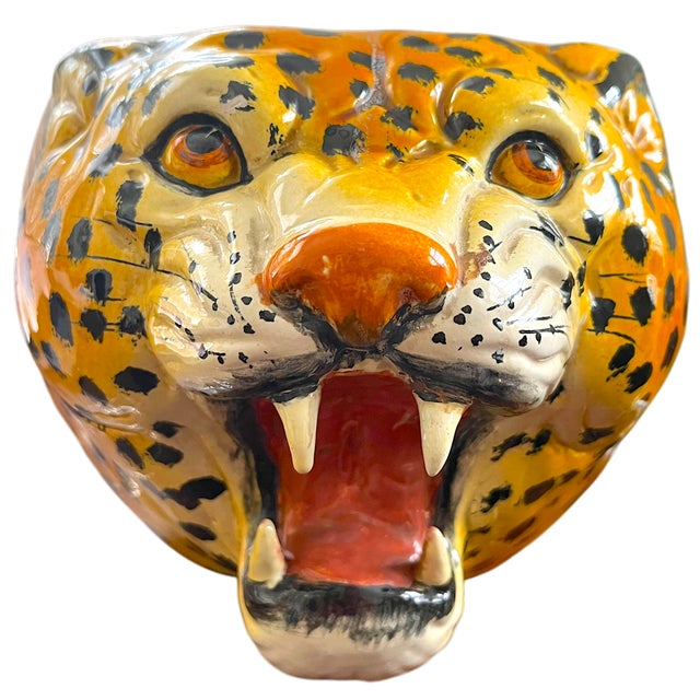 An exceptional and highly decorative sculptural leopard head cachepot, executed in richly glazed ceramic with striking...