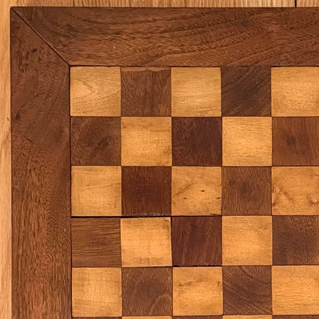 Vintage handmade wood chess and checkers board with beautiful wood detail. Heavy and solid piece. No maker's mark. Please...