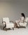 Here is a pair of armchairs, its cream upholstery, dark wood curved arms the first thing to catch the eye. Dating to 1950s...